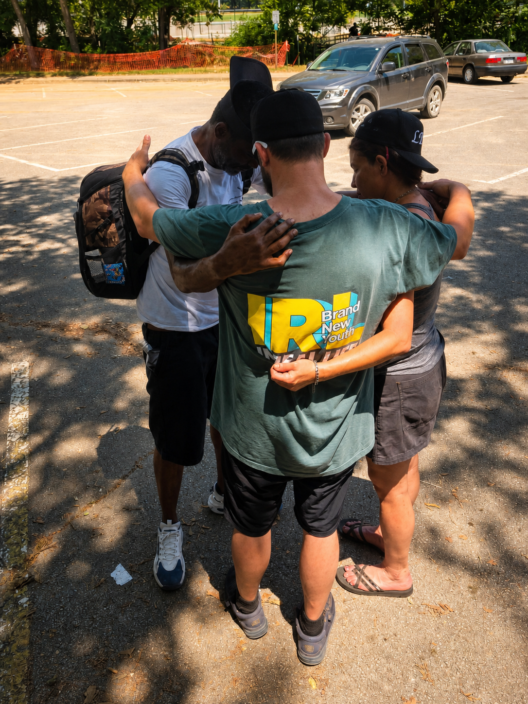 Neighbors and volunteers sharing encouragement at a community event